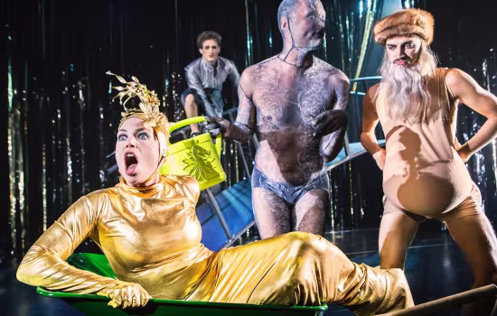 performer in gold clothes on a stage